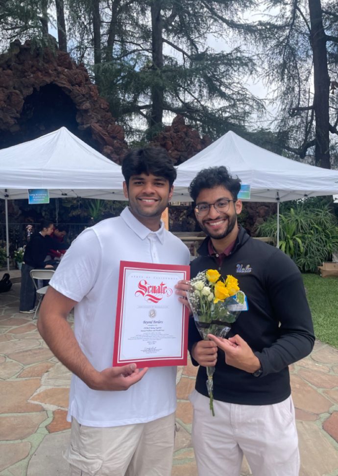 Zaid and Rishit holding a California State Senate certificate of recognition
