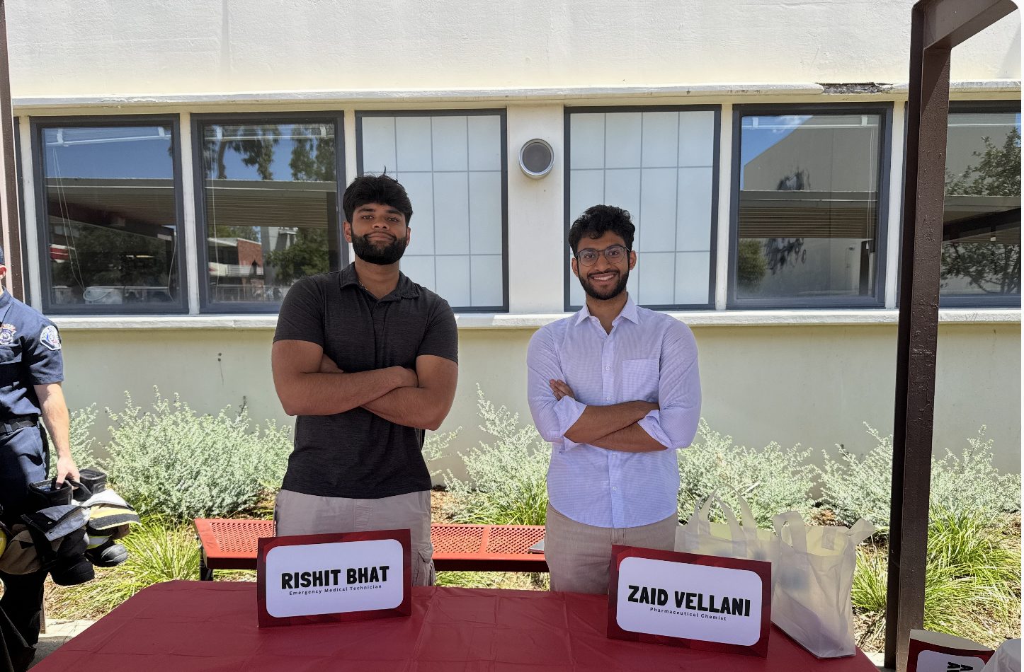 Zaid Vellani and Rishit Bhat at a Breathe Better Foundation outreach table