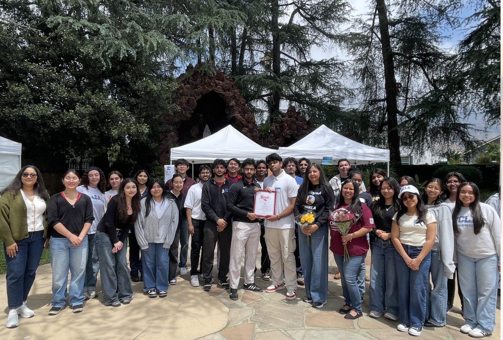UCLA chapter members receiving a California State Senate certificate of recognition